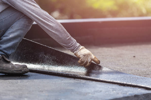 Professional Waterproofing technician working in Brookside, AL